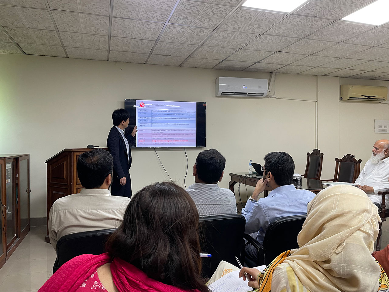 Muto giving a lecture at a training course on road and bridge maintenance management